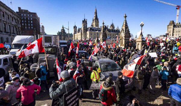 Protesters take part in the Freedom Convoy demonstrations against COVID-19 vaccine mandates and other restrictions on Parliament Hill in Ottawa on Jan. 29, 2022. (Adrian Wyld/The Canadian Press)