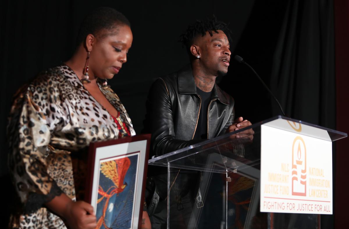 Patrisse Cullors, co-founder of Black Lives Matter, presents 21 Savage with an award at the NILC Courageous Luminaires Awards in Los Angeles on Oct. 3, 2019. (Jerritt Clark/Getty Images for NILC)