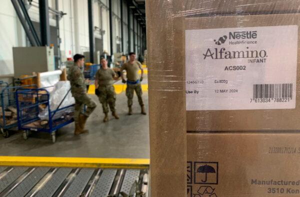 Soldiers at Ramstein Air Base in Germany load up boxes of baby formula ready for the first shipments from Europe to the United States, on May 21, 2022. (Erol Dogrudogan/Reuters)