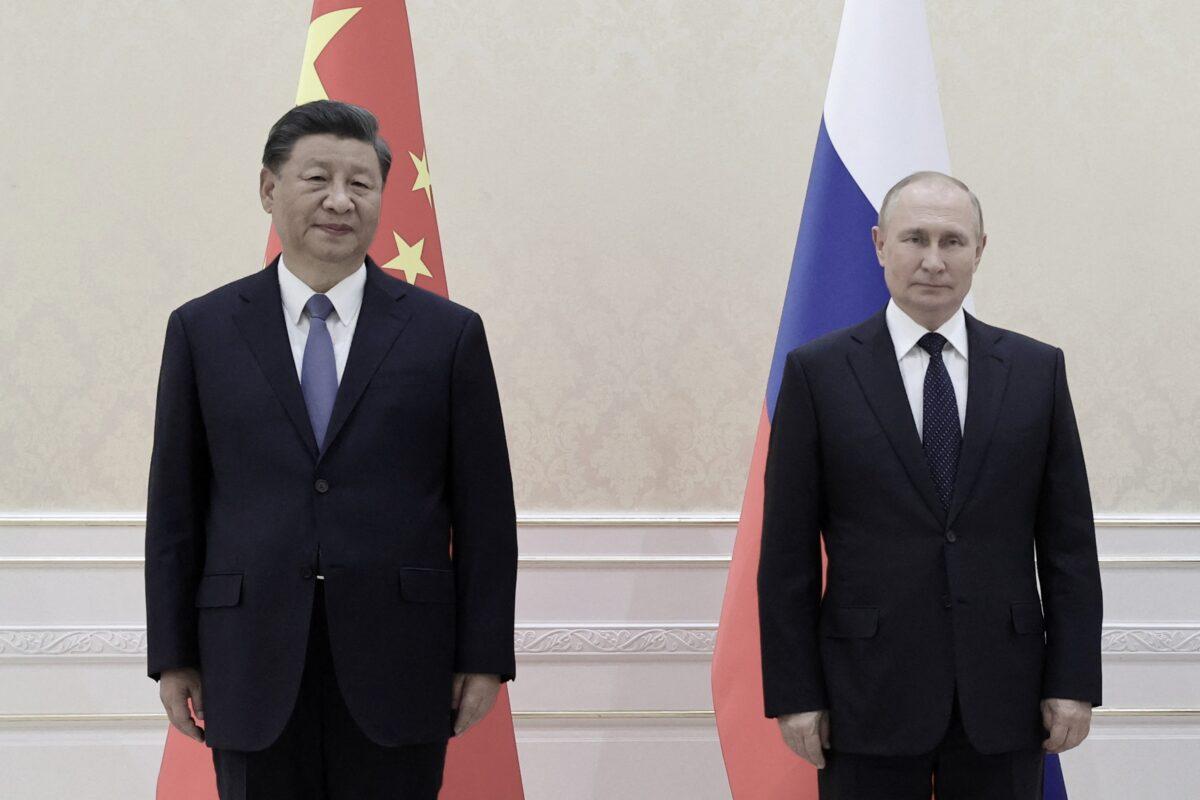 Chinese leader Xi Jinping and Russian President Vladimir Putin pose for photos on the sidelines of the Shanghai Cooperation Organization (SCO) leaders' summit in Samarkand, Uzbekistan, on Sept. 15, 2022. (Alexandr Demyanchuk/Sputnik/AFP via Getty Images)
