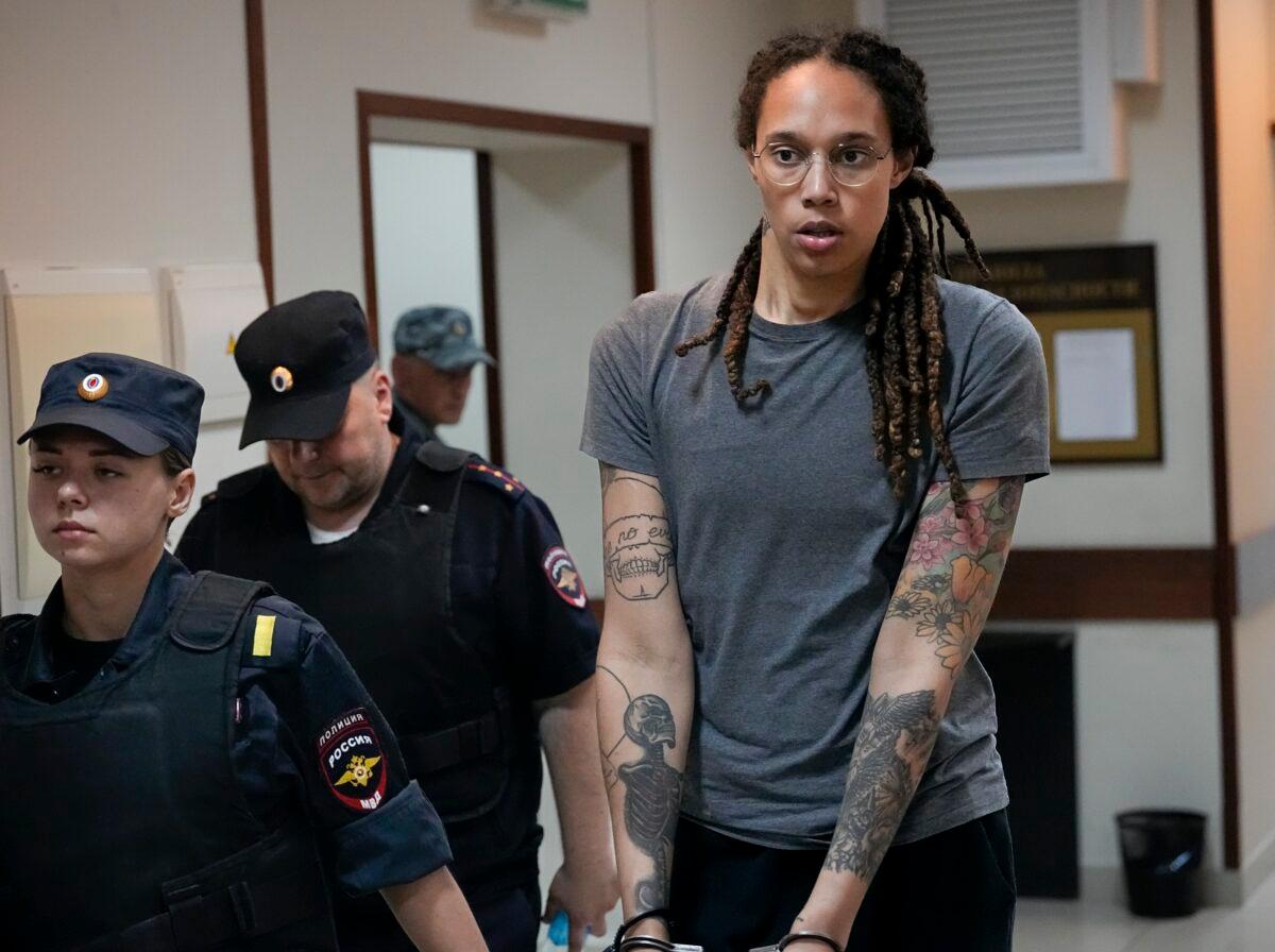 WNBA star and two-time Olympic gold medalist Brittney Griner is escorted from a courtroom after a hearing in Khimki, Russia, near Moscow, on Aug. 4, 2022. (Alexander Zemlianichenko/AP Photo)