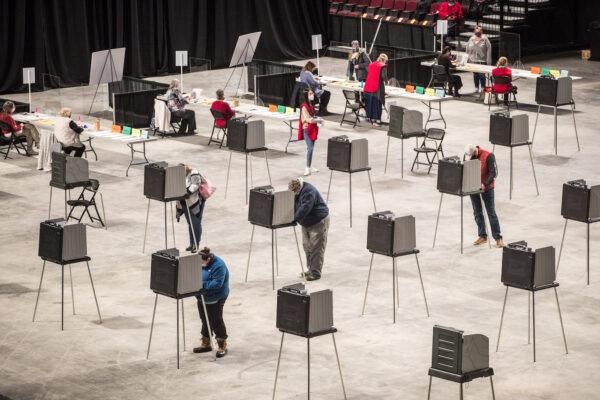 A file image of voters filling out and casting their ballots at the Cross Insurance Center polling location in Bangor, Maine for the 2020 presidential election on Nov. 3. (Scott Eisen/Getty Images)