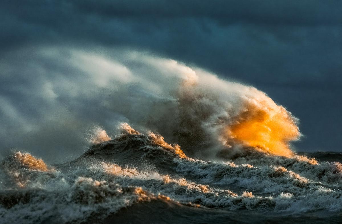 Waves warmly lit by the sun at Lake Erie in 2022. (Courtesy of <a href="https://www.instagram.com/trevorpottelbergphotography/">Trevor Pottelberg Photography</a>)