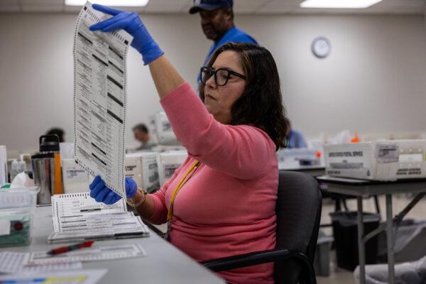 Election workers sort ballots at the Maricopa County Tabulation and Election Center in Phoenix, Arizona, on Nov. 9, 2022. (John Moore/Getty Images)