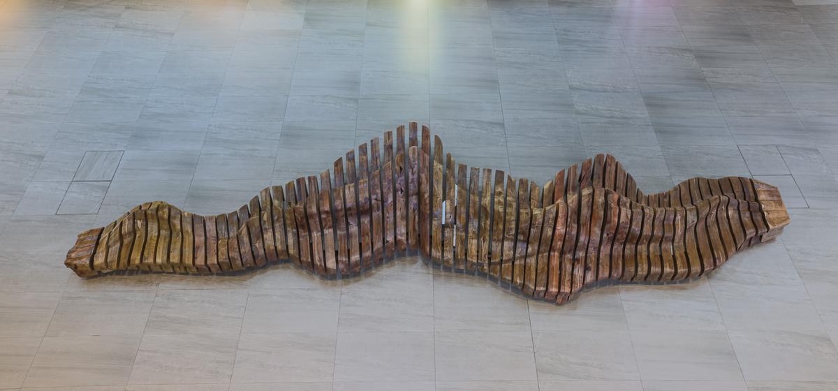 Ricci Wong said the inspiration behind the design of this long wooden bench came from the landforms of the mountains and sea of Lantau Island. (Courtesy of Ricci Wong)