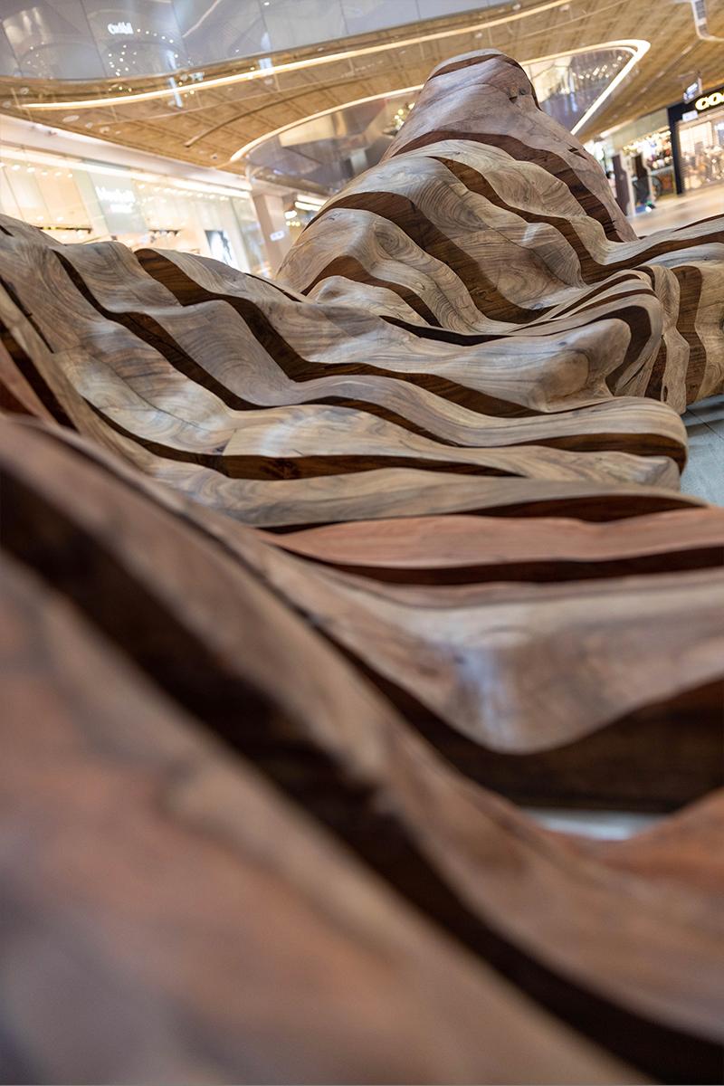 HK TimberBank adopted the landforms seen in Shuikou Village, Mui Wo, Tung Chung, and Chi Ma Wan Bay, on Lantau Island, to create long, recycled wood, public bench. (Courtesy of Ricci Wong)