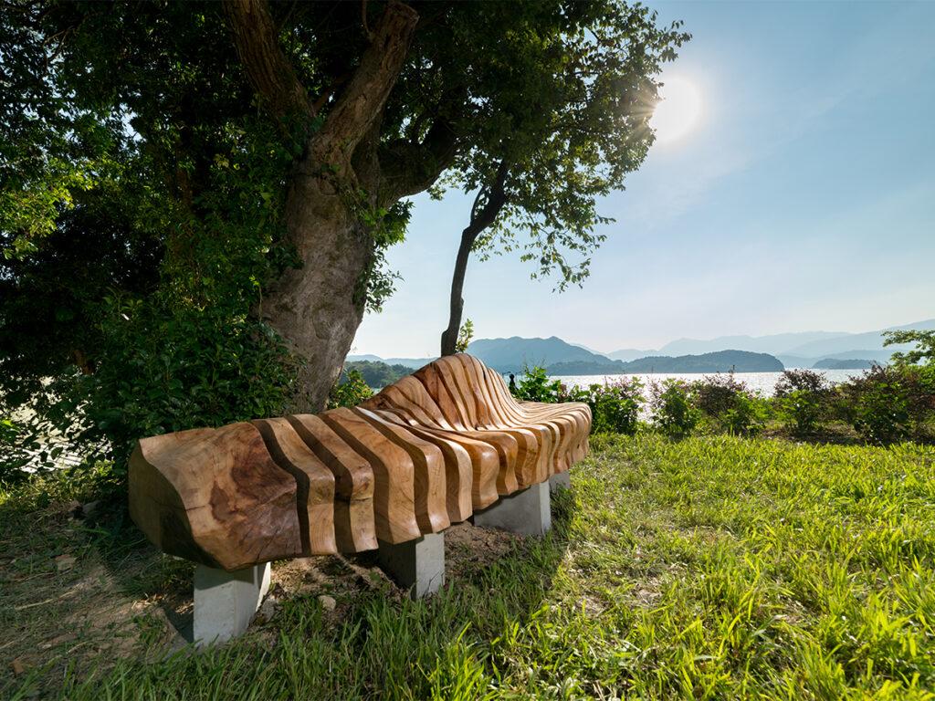Artistically designed wooden bench made from a recycled camphor tree uprooted by Typhoon Mangkhut in Yim Tin (Courtesy of Ricci Wong)