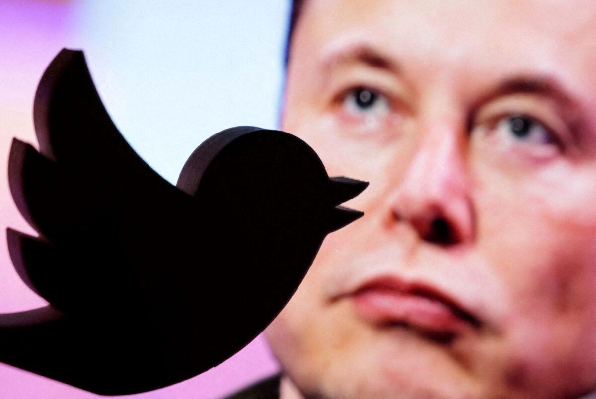 A 3D-printed Twitter logo is seen in front of a displayed photo of Elon Musk in this illustration taken on Oct. 27, 2022. (Dado Ruvic/Illustration/Reuters)