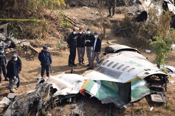 A French investigating team investigates the wreckage of a Yeti Airlines operated aircraft, in Pokhara, Nepal, on Jan. 18, 2023. (Krishna Mani Baral/Reuters)