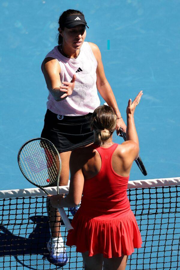 Jessica Pegula of the US shakes ahands with Ukraine's Marta Kostyuk (R) after their women's singles match on day five of the Australian Open tennis tournament in Melbourne on Jan. 20, 2023. (Martin Keep/AFP via Getty Images)