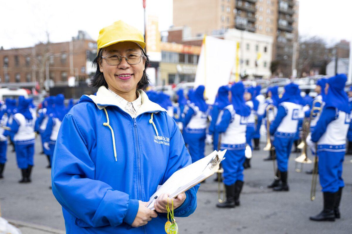 Falun Gong practitioner Wang Lirong participates in the 2023 Chinese New Year parade in Flushing, N.Y., on Jan. 21, 2023. (Chung I Ho/The Epoch Times)