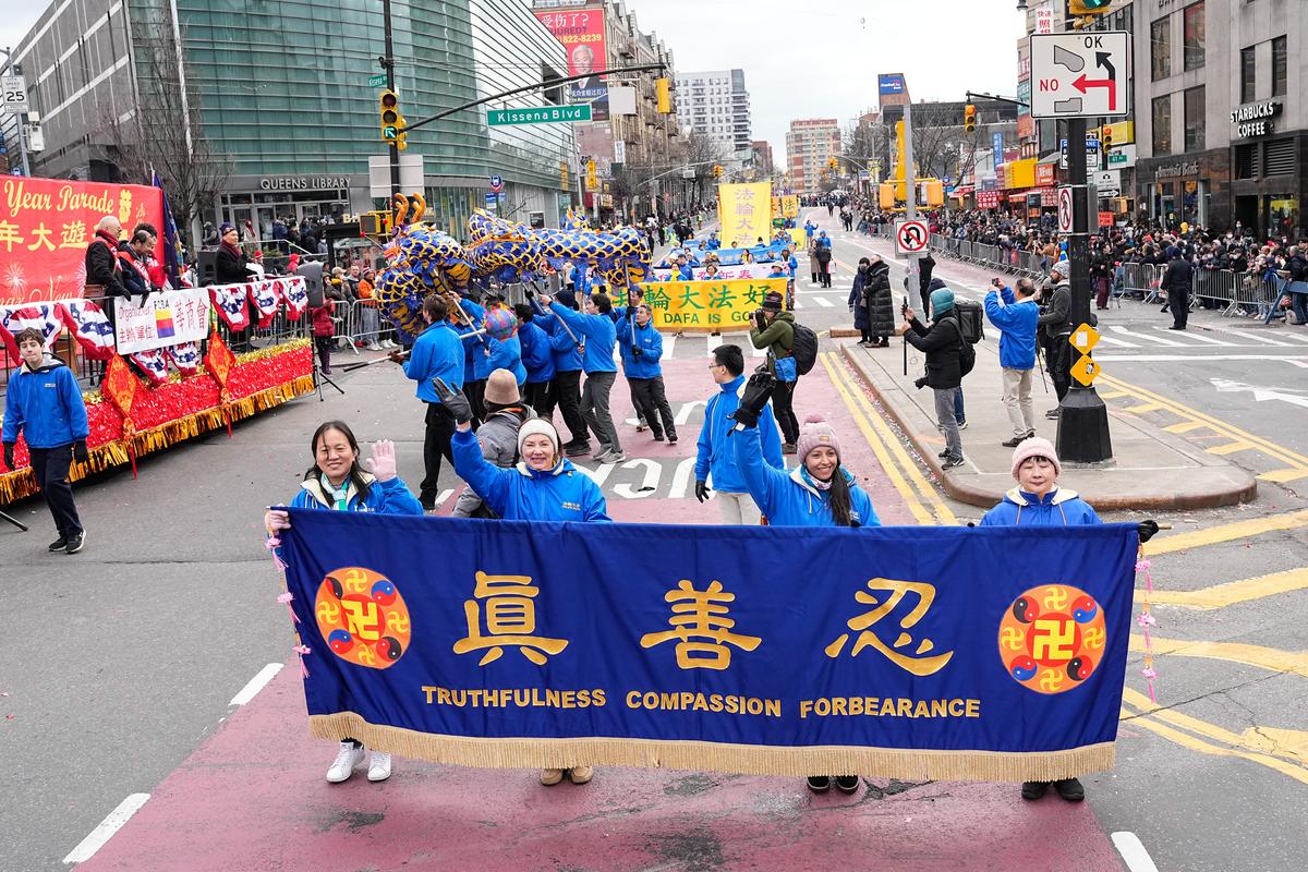 Falun Gong practitioners take part in the Chinese New Year Parade in Flushing of Queens, N.Y., on Jan. 21, 2023. (Larry Dye/The Epoch Times)