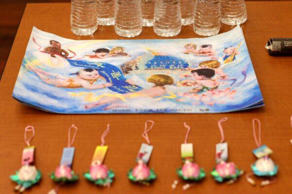 Painting prints on a table during an art exhibition reception in Milpitas, Calif., on Jan. 21, 2023. (Cynthia Cai/The Epoch Times)