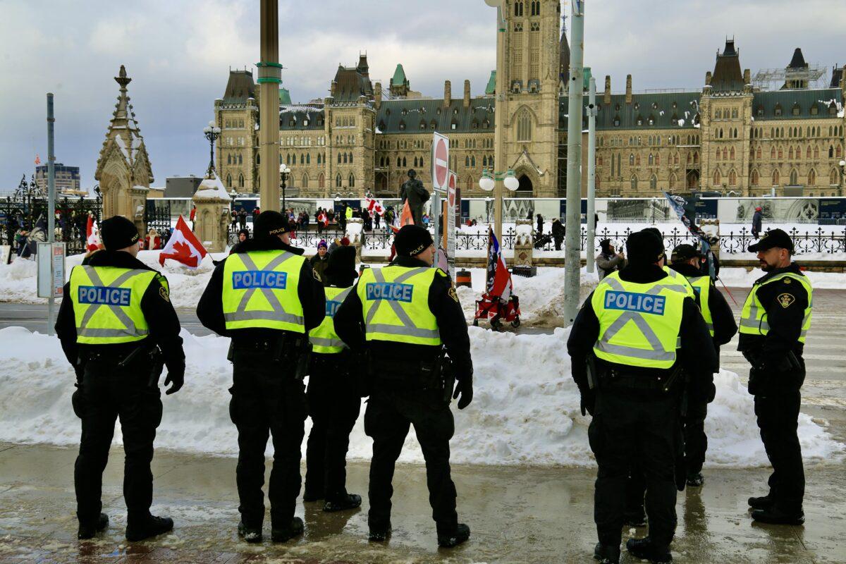 Ottawa police keep an eye on the celebration of the Freedom Convoy's first anniversary, on Jan. 28, 2023. (The Epoch Times/Jonathan Ren)