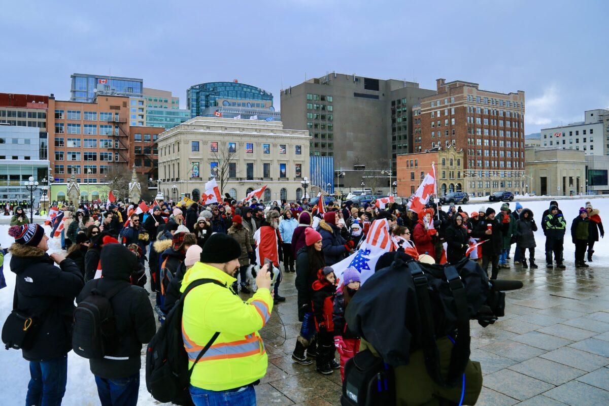 People gather on Parliament Hill to celebrate the first anniversary of the Freedom Convoy protest in Ottawa on Jan. 28, 2023. (The Epoch Times/Jonathan Ren)
