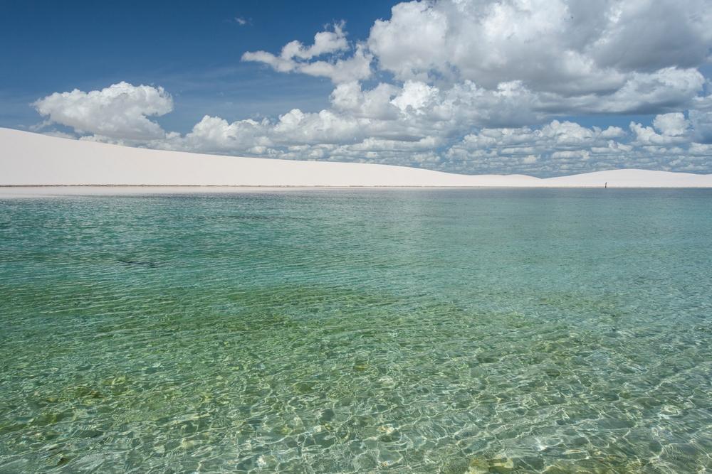 Lençóis Maranhenses features crystal-clear waters that create a surreal sight amid desert-like sand dunes. (vitormarigo/Shutterstock)