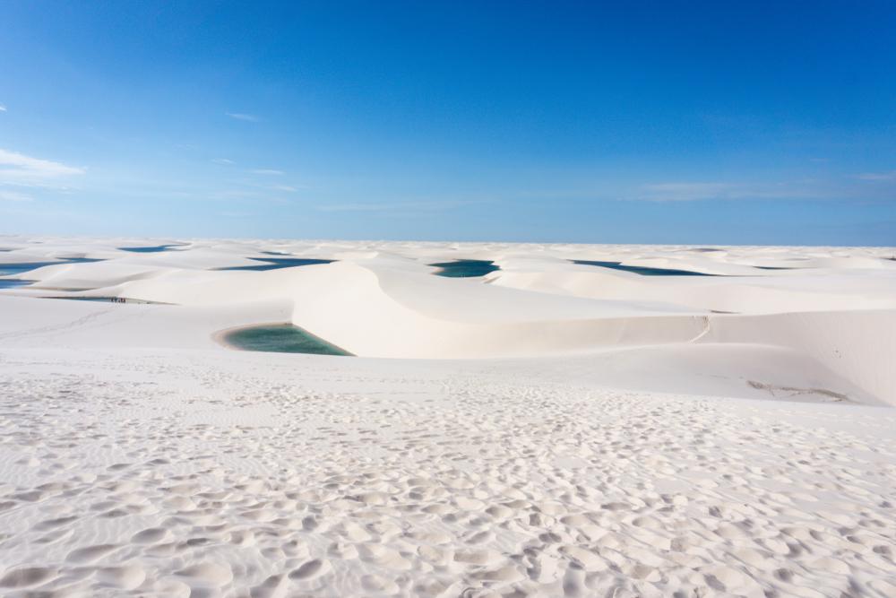 Lagoons seen amid sand dunes in the distance at Lençóis Maranhenses. (FELIPE TAVARES/Shutterstock)