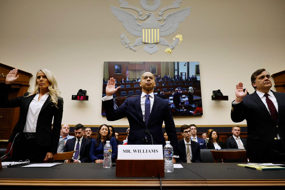 (L–R) Former Federal Bureau of Investigation agent Nicole Parker, Raben Group principal Elliot Williams, and George Washington University Law Center Professor Jonathan Turley are sworn in before testifying to the first hearing of the Weaponization of the Federal Government Subcommittee in the Rayburn House Office Building on Capitol Hill in Washington on Feb. 9, 2023. (Chip Somodevilla/Getty Images)