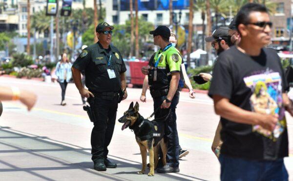 Police officers from the K-9 unit patrol in front of the convention center during San Diego Comic-Con International in San Diego on July 24, 2022. (Chris Delmas/AFP via Getty Images)