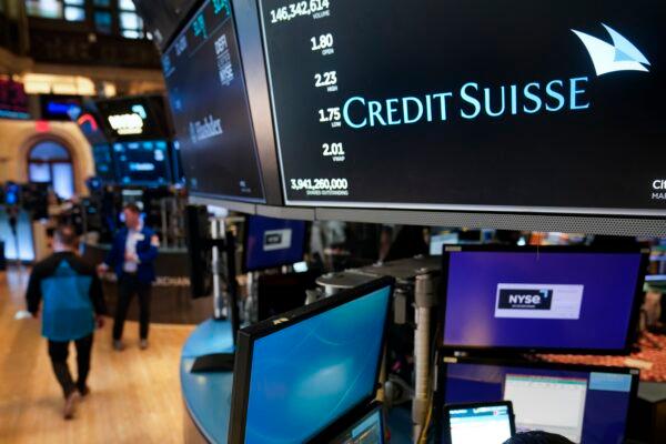 A sign displays the name of Credit Suisse on the floor at the New York Stock Exchange in New York on March 15, 2023. (Seth Wenig/AP Photo)