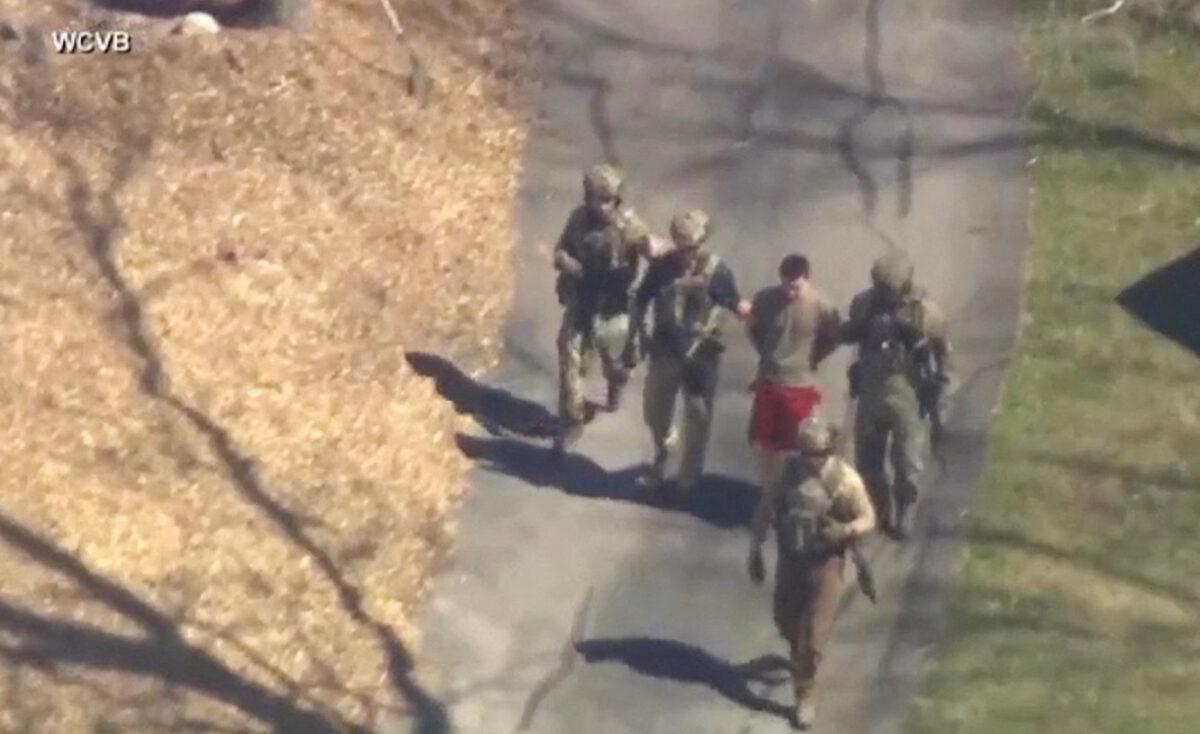 FBI agents arrest Jack Teixeira outside a residence in this still image taken from video in North Dighton, Mass., on April 13, 2023. (WCVB-TV via ABC via Reuters)