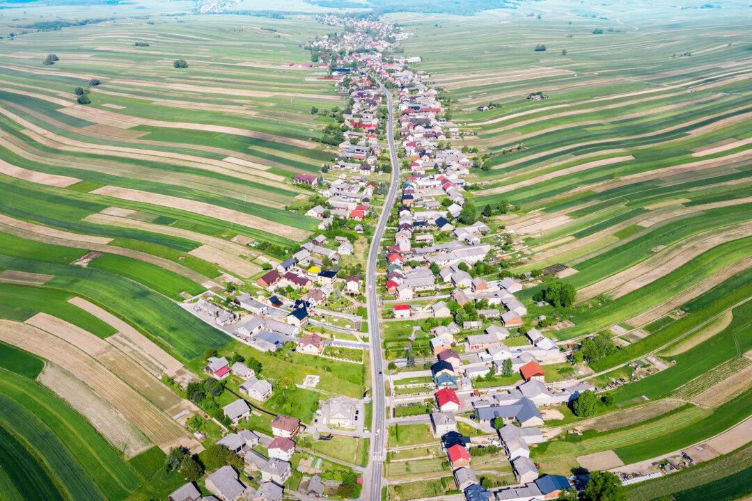 This Bizarre Town With Thin, Wavy Farms Looks Like Wonderland, Has One Road for 6,000 Villagers