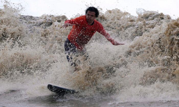 Surfers at Amazon’s Mouth Ride Some of World’s Longest-Lasting Waves