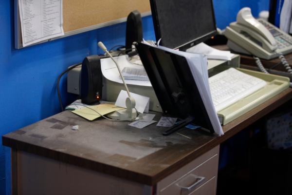 An empty spot on reporter Phyllis Zorn's desk shows where the tower for her computer sat before law enforcement officers seized it in a raid on the Marion County Record, in Kan., on Aug. 13, 2023. (John Hanna/AP Photo)