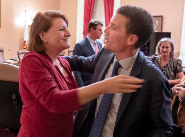 California state Senate President Toni Atkins (L) hugs Sen. Mike McGuire after he was named the successor to Ms. Atkins at the Capitol in Sacramento, Calif., on Aug. 28, 2023. (Rich Pedroncelli/AP Photo)