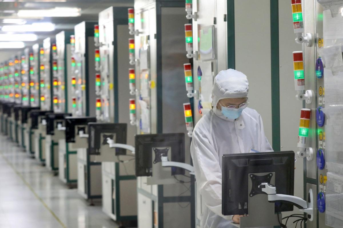 An employee works at a factory of Jiejie Semiconductor Company in Nantong, in eastern China's Jiangsu Province, on March 17, 2021. (STR/AFP via Getty Images)