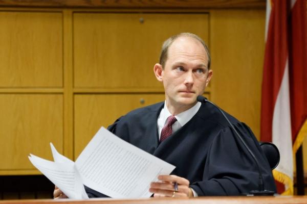 Fulton County Superior Judge Scott McAfee hears motions from attorneys representing Ken Chesebro and Sidney Powell, two co-defendants of former President Donald Trump, at the Fulton County Courthouse in Atlanta, Ga., on Sept. 14, 2023. (Miguel Martinez/Pool/AFP via Getty Images)