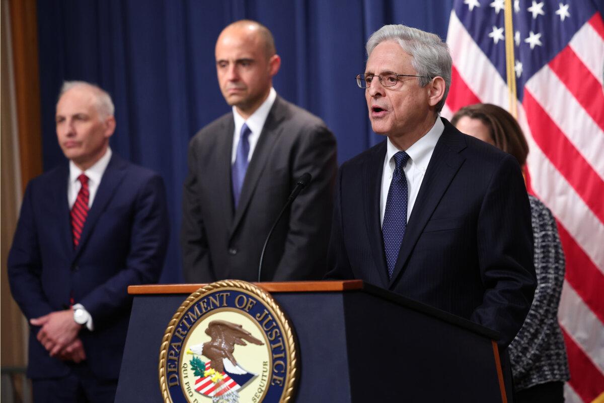U.S. Attorney General Merrick Garland speaks, as officials including U.S. Attorney for the District of Columbia Matthew Graves (center), listen, in Washington on May 4, 2023. (Win McNamee/Getty Images)