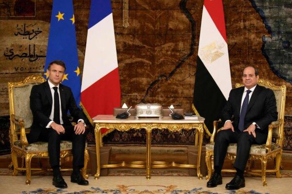 French President Emmanuel Macron (L) and Egyptian President Abdel-Fattah al-Sisi pose before their talks in Cairo on Oct. 25, 2023. (Christophe Ena/Pool/AFP via Getty Images)