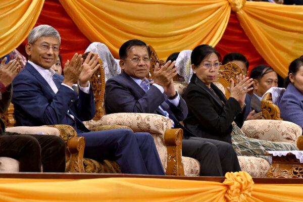 Myanmar's military chief Min Aung Hlaing (center) along with his wife (right) and China's ambassador to Myanmar Chen Hai (left) attend a ceremony on the eve of the Lunar New Year, in Yangon on Jan. 21, 2023. (AFP via Getty Images)