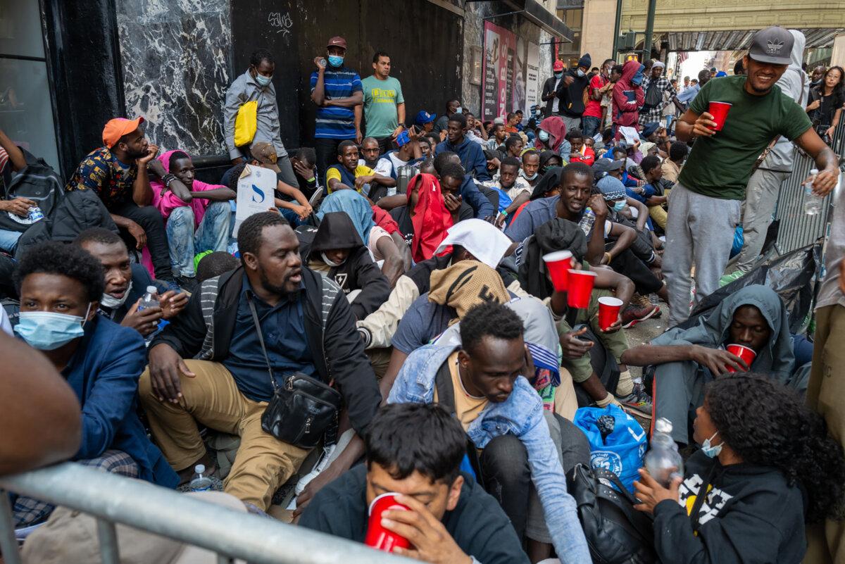 Dozens of recently arrived migrants to New York City camp outside of the Roosevelt Hotel, which has been made into a reception center, as they try to secure temporary housing in New York City on Aug. 1, 2023. (Spencer Platt/Getty Images)