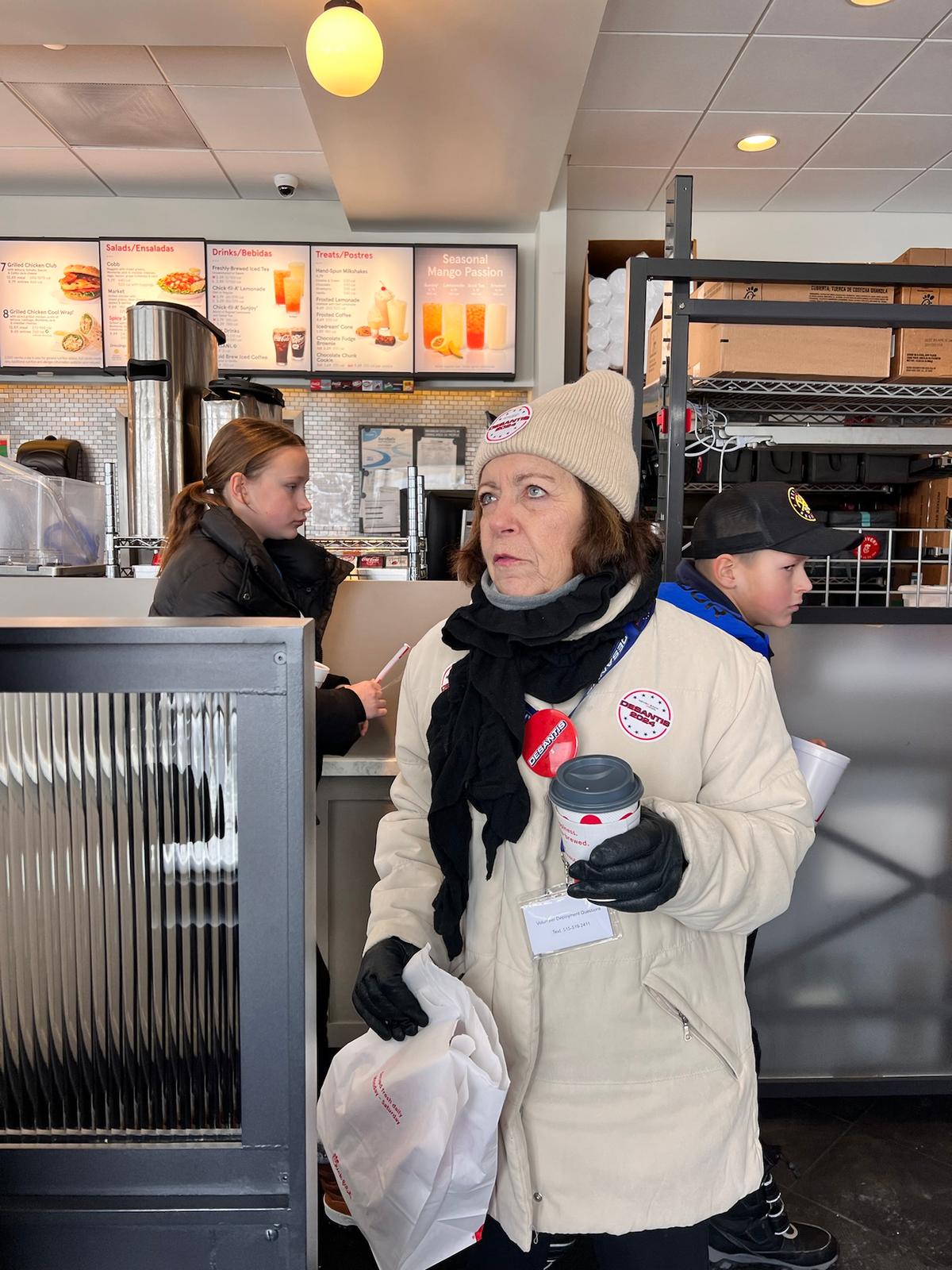 Karen DeSantis, the mother of Florida Gov. Ron DeSantis, walks through a Chick-fil-A restaurant in Des Moines, Iowa, on Jan. 13, 2024. (Madalina Vasiliu/Epoch Times)