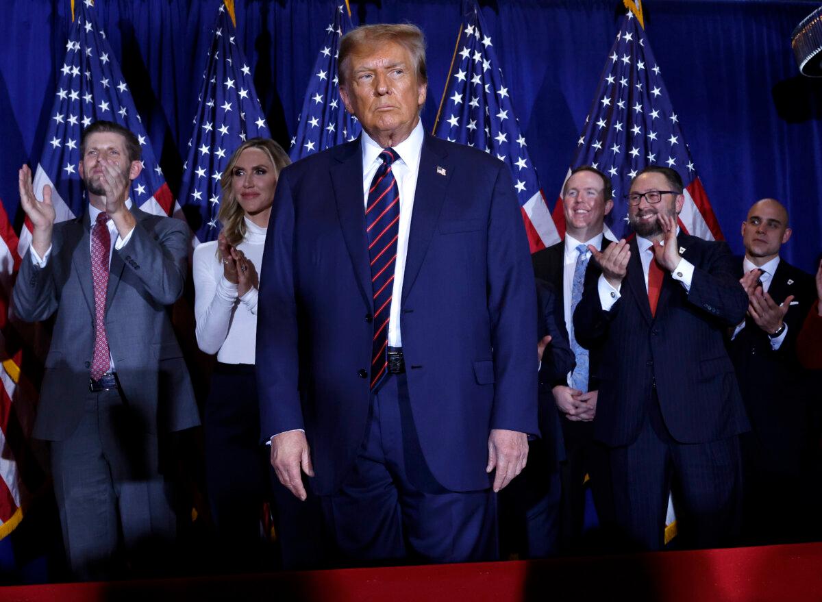 Republican presidential candidate and former U.S. President Donald Trump takes the stage with supporters, campaign staff and family members for a primary night party at the Sheraton on January 23, 2024 in Nashua, New Hampshire. (Chip Somodevilla/Getty Images)