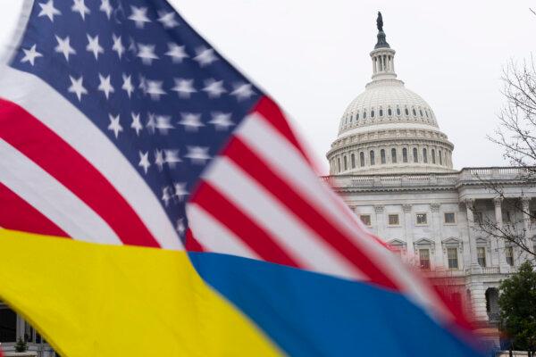 Ukraine sympathizers fly a Ukrainian flag outside as the Senate works on a $95.3 billion foreign aid bill with assistance for Ukraine and Israel at the U.S. Capitol in Washington on Feb. 11, 2024. (Tribune Content Agency)