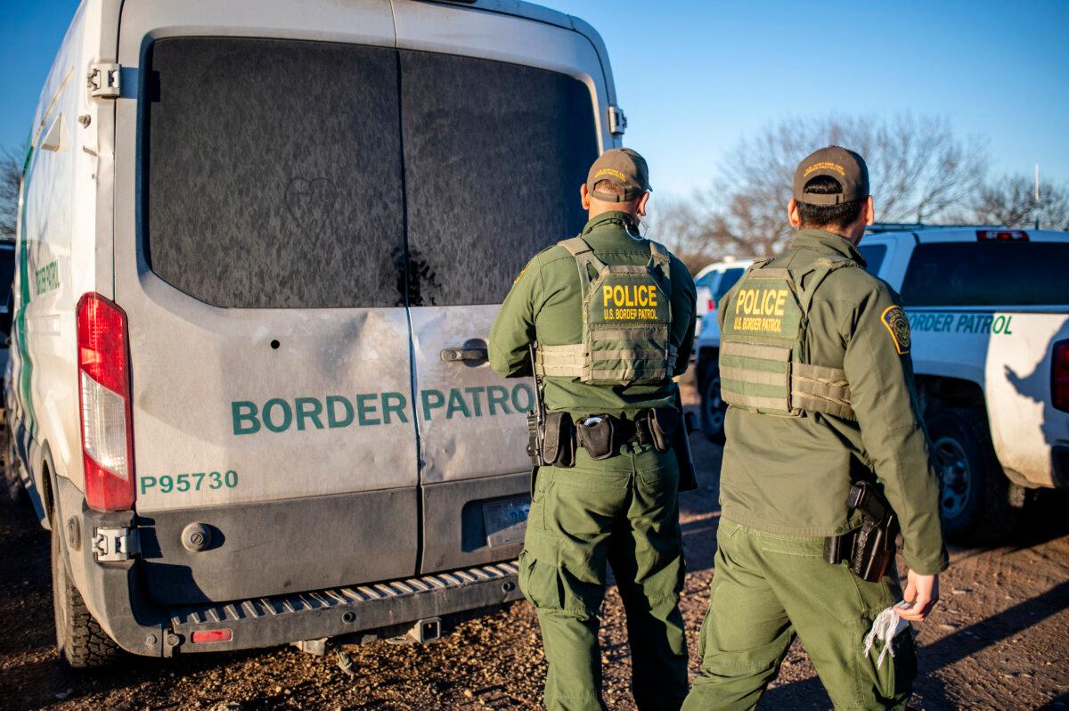 Border Patrol processes a group of about 60 illegal immigrants near the highway outside Eagle Pass, Texas, on Feb. 4, 2024. (Sergio Flores/AFP via Getty Images)