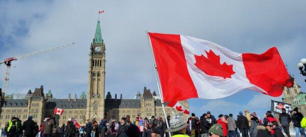 People gather on Parliament Hill for the two-year anniversary of the Freedom Convoy protest, on Feb. 17, 2024. (Matthew Horwood/The Epoch Times)