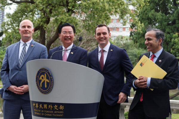 U.S. legislators attend a press conference with Taiwan Foreign Minister Joseph Wu in Taipei, Taiwan, on Feb. 22, 2024. L to R: Rep. John Moolenar (R-Mich.), Mr. Wu, Rep. Mike Gallagher (R-Wis.), Rep. Raja Krishnamoorthi (D-Ill.) (Ben Blanchard/Reuters)