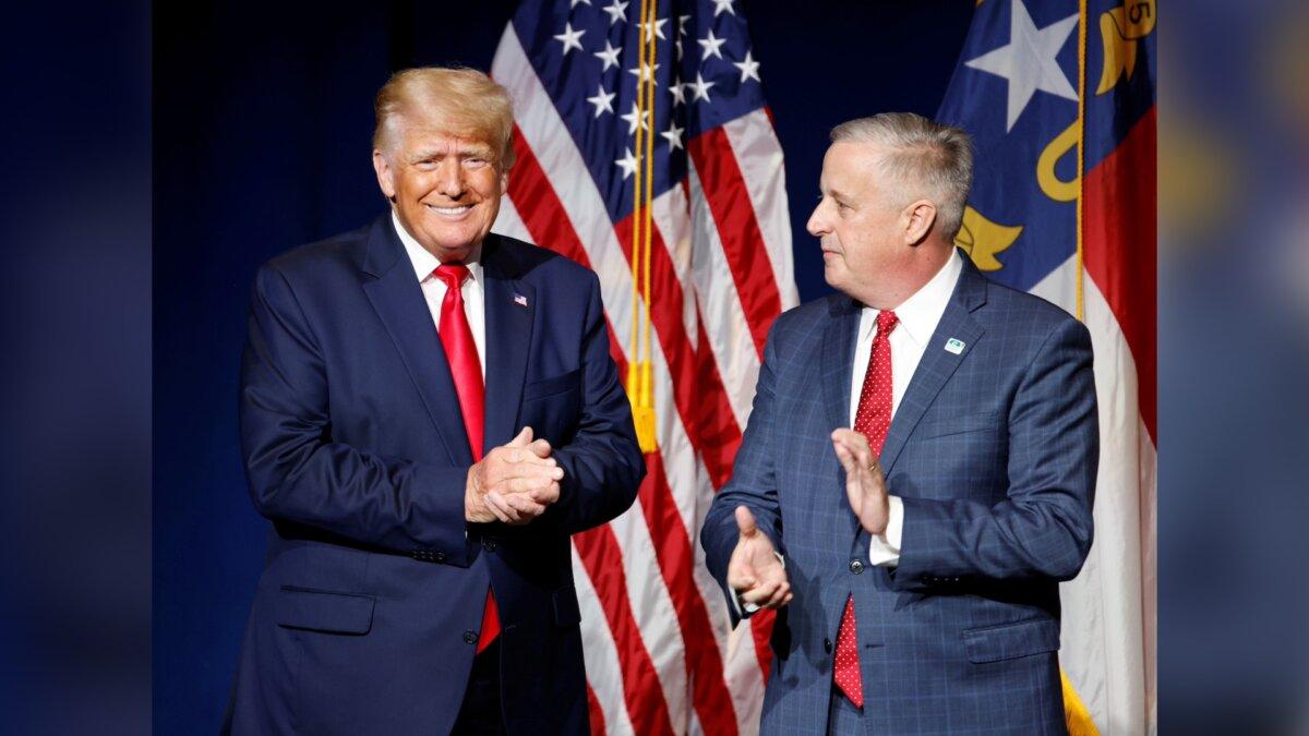 Former President Donald Trump (L) is introduced by North Carolina Republican Party chairman Michael Whatley before speaking in Greenville, N.C., on June 5, 2021. (Jonathan Drake/Reuters)