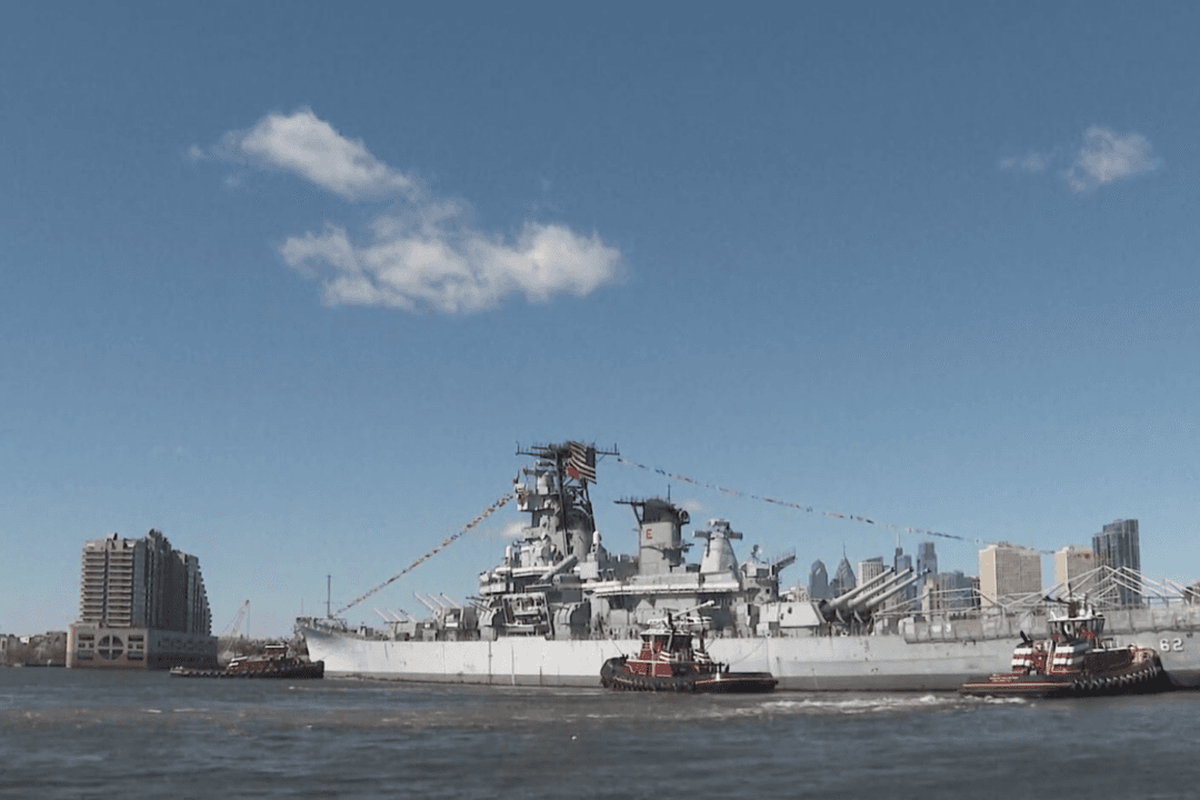 Crowds Watch Iconic Battleship Float Down Delaware River