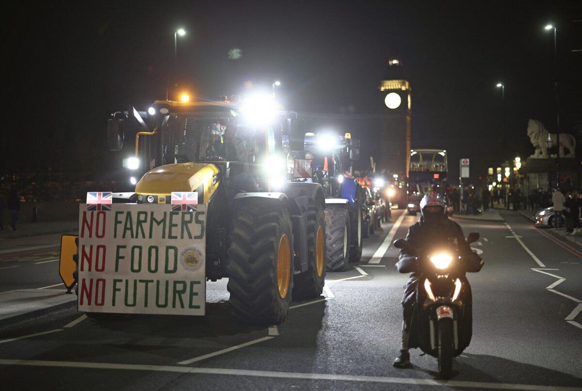 Farmers drive tractors back to the start point after a demonstration organised by Save British Farming against UK food policy, substandard imports and stricter food labelling regulations, in central London on March 25, 2024. (Henry Nicholls/AFP via Getty Images)