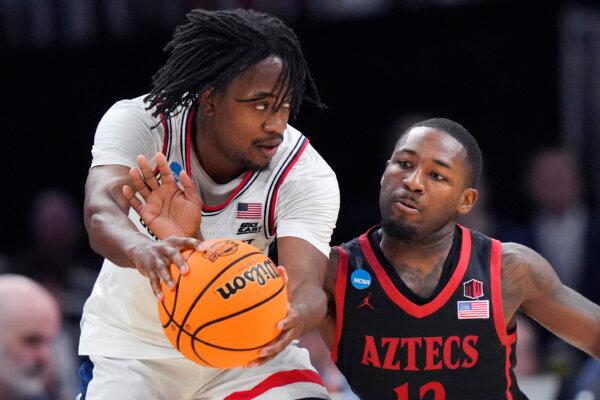 San Diego State's Darrion Trammell (R) attempts a steal against UConn's Tristen Newton during an NCAA Tournament game in Boston on March 28, 2024. (Steven Senne/AP Photo)