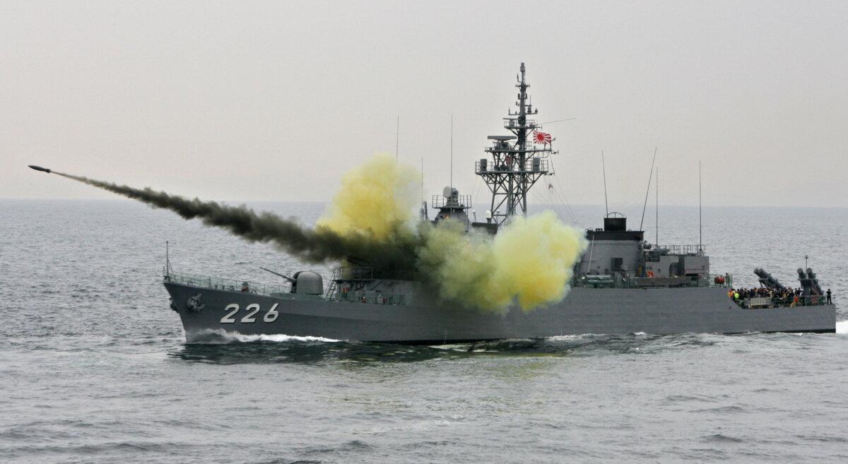 An anti-submarine rocket blasts off a rocket launcher of the Maritime Self-Defense Force (MSDF) escort ship Ishikari during its fleet review exercise off Sagami Bay, south of Tokyo, on Oct. 22, 2007. (Kazuhiro Nogi/AFP via Getty Images)