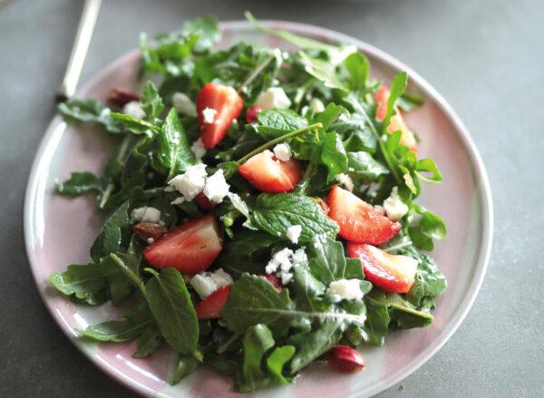 Fresh mint adds the finishing touch to this arugula and strawberry salad, a springtime staple in Ms. Kochilas's kitchen. (Vasilis Stenos)