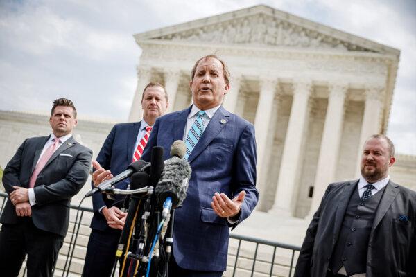 Texas Attorney General Ken Paxton (C) talks to reporters with Missouri Attorney General Eric Schmitt (2nd L) and Texas Solicitor General Judd Stone (R) in front of the U.S. Supreme Court in Washington, on April 26, 2022. (Chip Somodevilla/Getty Images)