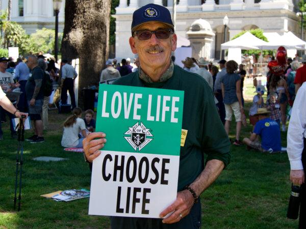 Greg Marracq, California state deputy for the Catholic organization Knights of Columbus, joins the California March for Life in Sacramento on April 22, 2024. (Travis Gillmore/The Epoch Times)