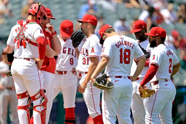 Pitching coach Barry Enright (84) of the Los Angeles Angels talks with starting pitcher Tyler Anderson (31) on the mound as Logan O'Hoppe (14), Nolan Schanuel (18), Luis Rengifo (2), Miguel Sanó (22) and Zach Neto (9) look on in the third inning against the Baltimore Orioles at Angel Stadium of Anaheim in Anaheim, Calif., on April 24, 2024. (Jayne Kamin-Oncea/Getty Images)